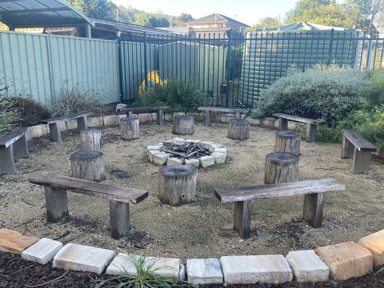 yarning circle around fire pit in aboriginal garden