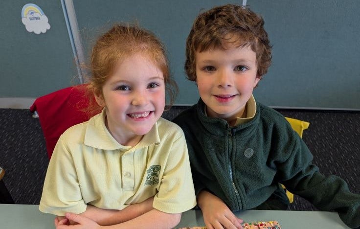 2 kindergarten students at a desk
