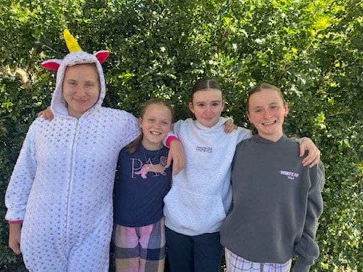 4 girls on warm and cozy day wearing pj's